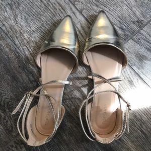 Muted gold pointed flats.